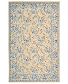 Attractive floral images make this country-style rug a delightful addition to any room. Woven from plush wool, the Country Heritage rug features a muted yellow field, speckled with beautiful blues and whites. Attractive floral images make this country-style rug a delightful addition to any room. Woven from plush wool, the Country Heritage rug features a muted yellow field, speckled with beautiful blues and whites.