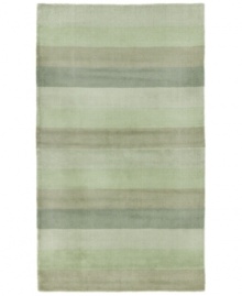 Hand-tufted, blended wool gives an exceptionally soft feel to this rug from the Coastal Treasures collection. In a shimmering, striped design of moss-green colorways, this sophisticated piece adds serene character to every decor. Hand-tufted, blended wool gives an exceptionally soft feel to this rug from the Coastal Treasures collection. In a shimmering, striped design of moss-green colorways, this sophisticated piece adds serene character to every decor.