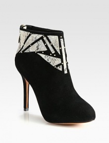 Geometric python cutouts and metal goldtone studs top this buttery suede ankle boot with a hidden platform for superior fit. Self-covered heel, 4¼ (110mm)Hidden platform, ¾ (20mm)Compares to a 3½ heel (90mm)Suede upper with python cutouts and gold metal studsBack zipLeather lining and solePadded insoleImported