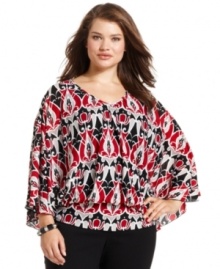 Liven up your neutral bottoms with Style&co.'s batwing sleeve plus size top, punctuated by banded hem.