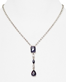 A delicate stone and crystal pendant is a glamorous focal point on this Carolee necklace, crafted of silver plated metal.