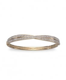 All the sparkle you love, with a twist. This stunning Swarovski bangle shines with clear crystal pave set in two bands of gold-plated mixed metal crossed at center. Approximate diameter: 3-1/4 inches.