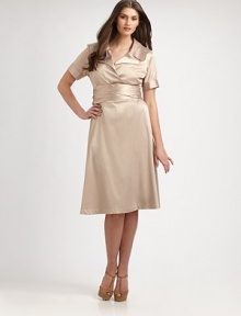 An elegant stretch satin design inspired by the classic trench coat. Collar neckShort sleevesButton-detail cuffsSelf-tie at waistAbout 25 from natural waist55% polyester/42% rayon/3% spandexDry cleanMade in USA of imported fabric