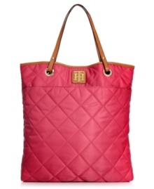 Play up your preppy side with this take-anywhere tote from Tommy Hilfiger. Durable nylon is dressed in a pretty quilted pattern, while signature golden hardware provides the perfect finishing touches.