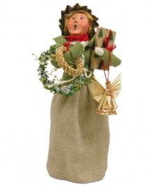 She's got her arms full, but this young woman is thrilled with the unique crafted ornaments destined to go on and under her tree. A great find from Byers' Choice.