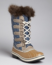 A stylishly cozy burst of faux fur and chic, quilted nylon make winter's blasts a little less daunting; by Sorel.