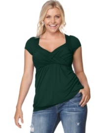 Soprano upgrades the cap sleeved plus size top with an enhancing crisscross front and slimming empire waist. Soprano upgrades the cap sleeved plus size top with an enhancing crisscross front and slimming empire waist.
