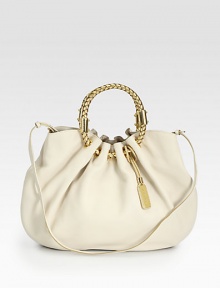 Supple leather with radiant hardware and a metallic, braided ring handle.Double top handles, 5½ dropDetachable adjustable shoulder strap, 19-22 dropSnap button closureThree inner compartmentsOne inside zip pocketTwo inside open pocketsLinen lining19W X 13½H X 2½DImported Supple leather with radiant hardware and a metallic, braided ring handle.Double top handles, 5½ dropDetachable adjustable shoulder strap, 19-22 dropSnap button closureThree inner compartmentsOne inside zip pocketTwo inside open pocketsLinen lining19W X 13½H X 2½DImported