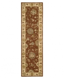 Bring new life to any room of your home. This gorgeous rug, sprouting intricate designs of vinery and blossoming flowers, opens up any space with warm tones of burnt red and beige. With an all-wool construction, accented with rich silk highlights, this stylish Nourison 2000 import is ultra-durable and luxuriously soft to the touch.