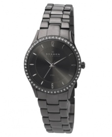 A sultry, smoky watch by Skagen Denmark. Charcoal stainless steel bracelet and round case. Bezel crystallized by Swarovski elements. Charcoal dial with silvertone stick indices and logo. Quartz movement. Water resistant to 30 meters. Limited lifetime warranty. A sultry, smoky watch by Skagen Denmark. Charcoal stainless steel bracelet and round case. Bezel crystallized by Swarovski elements. Charcoal dial with silvertone stick indices and logo. Quartz movement. Water resistant to 30 meters. Limited lifetime warranty.
