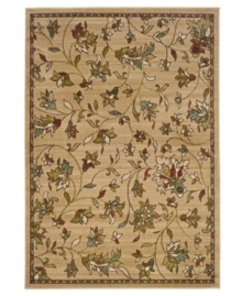 Beauty underfoot. A lush floral-and-leaf motif evokes a casual elegance, enhancing your space with a delicate, muted palette. This plush area rug from Sphinx graces any space with a quiet charm and is woven from durable polypropylene, ensuring long-lasting beauty for years to come.