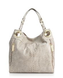 Add some interest to your everyday look with this gorgeous snakeskin print design by Steve Madden. Polished goldtone hardware and unique side zip detailing add the perfect finishing touches. Add some interest to your everyday look with this gorgeous snakeskin print design by Steve Madden. Polished goldtone hardware and unique side zip detailing add the perfect finishing touches.
