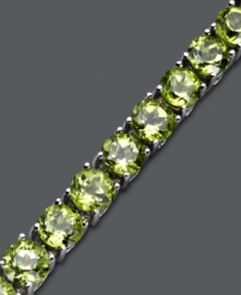 Make others green with envy. A seamless row of round-cut peridots (18 ct. t.w.) glow in a polished sterling silver setting. Approximate length: 7 inches.