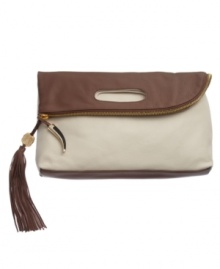Incredibly supple leather lends a slouchy feel to the oversize Juliann Clutch from Vince Camuto. This reversible, foldover clutch has contrasting colors on both sides that can be flipped to highlight either tone, a zipper closure and luxe horn and tassel detailing at the closure. Incredibly supple leather lends a slouchy feel to the oversize Juliann Clutch from Vince Camuto. This reversible, foldover clutch has contrasting colors on both sides that can be flipped to highlight either tone, a zipper closure and luxe horn and tassel detailing at the closure.