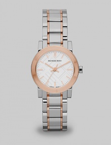 In a subtle reference to those beloved Burberry checks, this elegant stainless steel timepiece has a patterned face and warm rose goldplated accents.Quartz movementWater resistant to 5 ATMStainless steel round case with IP rose goldplated accents, 26mm diameter (1)Polished bezelSapphire crystalCheck-pattern white dialRose goldplated bar hour markersSecond handTwo-tone link bracelet with fold over buckleMade in Switzerland