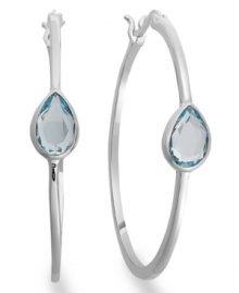 Traditional hoops with a sparkling pop of color. Victoria Townsend's glam style features pear-cut blue topaz (2-1/5 ct. t.w.) in a shining sterling silver setting. Approximate diameter: 1-1/2 inches. Traditional hoops with a sparkling pop of color. Victoria Townsend's glam style features pear-cut blue topaz (2-1/5 ct. t.w.) in a shining sterling silver setting. Approximate diameter: 1-1/2 inches.
