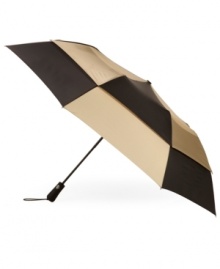 Totes tackles both the rain and wind with the durable vented design of this maximum coverage golf umbrella, a go-to for the greens. Totes tackles both the rain and wind with the durable vented design of this maximum coverage golf umbrella, a go-to for the greens.