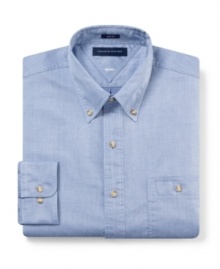 Slim-fit tailoring adds to the sleek appeal of this versatile dress shirt from Tommy Hilfiger.