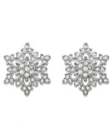 Delicate and refined -- Swarovski's sparkling stud earrings feature a pretty snowflake-shaped silhouette. Crafted in silver tone mixed metal with sparkling crystal pavé. Approximate diameter: 1 inch.