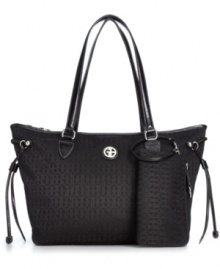 For the love of logo. Showcase signature style with this take-anywhere tote from Giani Bernini, featuring monogram jacquard with gleaming hardware. Ultra-spacious and pocket-lined, it's destined to be your new fab favorite. For the love of logo. Showcase signature style with this take-anywhere tote from Giani Bernini, featuring monogram jacquard with gleaming hardware. Ultra-spacious and pocket-lined, it's destined to be your new fab favorite.