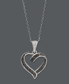 Romance comes easy in this chic, contrasting style. Victoria Townsend's standout heart pendant highlights sparkling black diamond accents and white diamond accents at the bail. Setting and chain crafted in sterling silver. Approximate length: 18 inches. Approximate drop: 15/16 inch.