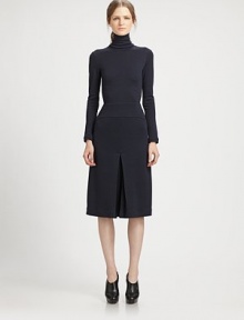 This chic, artfully tailored one-piece features a flattering culotte silhouette.TurtleneckLong sleevesPanel constructionInverted front and back pleatsConcealed back zipSilk liningAbout 44 from shoulder to hemWoolDry cleanMade in USA of Italian fabricModel shown is 5'10 (177cm) wearing US size 4. 