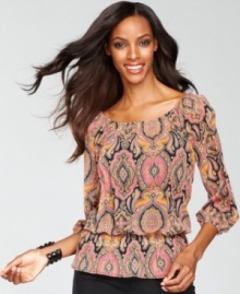 An exotic print lends a boho-chic feel to INC's petite peasant top. A peplum hem gives this piece an on-trend touch.