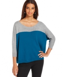 Colorblocked construction lends a modern look to this slouchy sweater from DKNY Jeans.