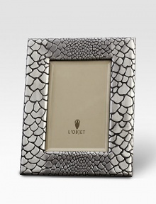 A meticulously handcrafted frame, platinum plated, with a stretched leather back. From the Python CollectionPlatinum platedImportedDIMENSION INFORMATION4 X 6 (5 X 7 overall)5 X 7 (7 X 9 overall) A meticulously handcrafted frame, platinum plated, with a stretched leather back. From the Python CollectionPlatinum platedImportedDIMENSION INFORMATION4 X 6 (5 X 7 overall)5 X 7 (7 X 9 overall)