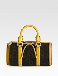 A luxurious blend of leather, velvet and nubuck leather in a well-crafted, petite design with a sweet bow.Double leather top handles, 5¼ dropTop zip closureProtective metal feetOne inside zip pocketTwo inside open pocketsCotton lining13½W X 7H X 6¼DMade in Italy
