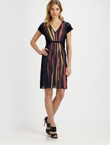 Wavy stripes lend a fascinating look to this colorful design with a waist-accentuating belt.V-necklineCap sleevesBelted designSolid trimFully linedAbout 37 from shoulder to hem67% cotton/22% linen/11% viscoseDry cleanImported Model shown is 5'10½ (179cm) wearing US size 4. 