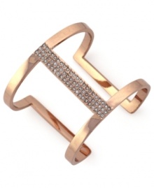 Airy elegance. Vince Camuto's cut-out cuff bracelet is crafted from rose gold-tone mixed metal with glass crystal accents adding a lustrous touch to the eclectic piece. Approximate diameter: 3-1/2 inches.