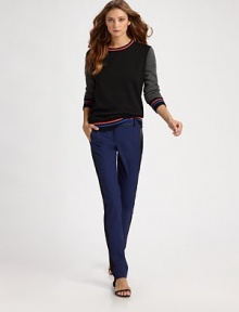 Comfortable wool knit with colorblocked sleeves, banded with colorful stripes at the neck, cuffs and hem.Ribbed crewneckRib-knit cuffs and hemV stitching at necklineWoolDry cleanImported