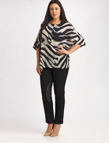 Made from irresistible Italian silk, this zebra-print top offers you a comfortable fit, thanks to convenient side slits. Round neckElbow-length sleevesConcealed button placketPull-on styleAllover printRelaxed fitSide slitsAbout 32 from shoulder to hemSilkDry cleanImported of Italian fabric