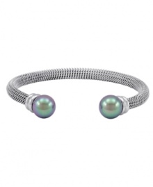 Intriguingly iridescent. Black organic made-made pearls add distinguished decorative detailing to Majorica's bangle bracelet. Set in silver tone stainless steel, it's an elegant enhancement for daytime or evening. Approximate diameter: 2-1/2 inches.