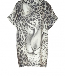 Bold printed tunic top in wool and silk brings style to casual, Downtown looks - Features black and white leopard print with drama close-up - Long loose fit with short, wide sleeves and crew neckline - Pair with skinny jeans, leggings or leather pants and heels