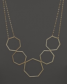 A modern statement necklace in yellow gold from Lana.