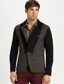 The next level of stylish suiting separates, this trend-setting design features a chevron tweed pattern with contrasting collar and sleeves and leather elbow patch detail for a surprising finishing touch.Button-frontChest, waist welt pocketsRear ventAbout 27 from shoulder to hem50% polyamide/50% woolDry cleanImported