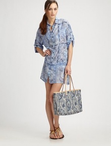 An airy paisley coverup with button-tab sleeves and a relaxed fit.Pointed collarButton frontButton-tab three-quarter sleeves70% cotton/30% silkMade in Italy An airy paisley coverup with button-tab sleeves and a relaxed fit.Pointed collarButton frontButton-tab three-quarter sleeves70% cotton/30% silkMade in Italy