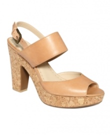 Classic neutral colors make it easy to embrace this trendy silhouette. The Yancy cork platforms by Adrienne Vittadini are sandals you can wear for work and play.