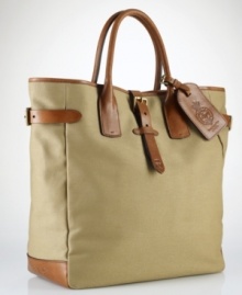 A superior carryall for daily essentials, a polished canvas bag is constructed with saddle-inspired leather trim and comfortable rolled handles and features organizational interior pocketing for quick access to the necessities.