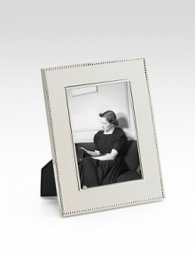 A stunning display for a treasured photograph, designed in heirloom-quality sterling silver with tiny-bead trim. Accommodates a 4 X 6 photograph Overall, 8¼ X 10 Sterling silver Made in USA 