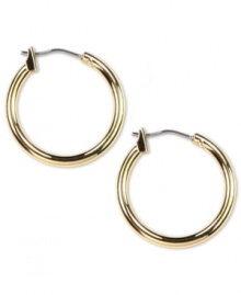 Classic hoops for an instant fashion fix! Earrings crafted in gold tone mixed metal with a click backing. Approximate diameter: 3/4 inch.