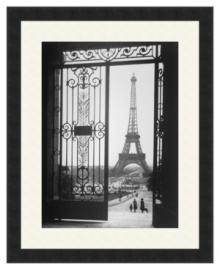The defining symbol of the City of Lights, the soaring Eiffel Tower is the focal point of this elegant black-and-white print, taken from the famous Trocadero Esplanade in Paris. A satin black frame creates a sleek modern finish. The defining symbol of the City of Lights, the soaring Eiffel Tower is the focal point of this elegant black-and-white print, taken from the famous Trocadero Esplanade in Paris. A satin black frame creates a sleek modern finish.