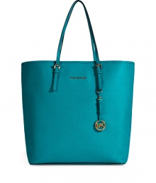 Sophisticated with simple, clean lines, MICHAEL Michael Kors textured leather tote is an elegant and versatile choice - Flat double top handles with buckle detail at base, metal logo on front, logo charm attached to handle, inside zippered back wall pocket, front wall slot pocket, cinch strap, strap with clip attached for keys - The perfect choice for work, school or running errands Sophisticated with simple, clean lines, MICHAEL Michael Kors textured leather tote is an elegant and versatile choice - Flat double top handles with buckle detail at base, metal logo on front, logo charm attached to handle, inside zippered back wall pocket, front wall slot pocket, cinch strap, strap with clip attached for keys - The perfect choice for work, school or running errands