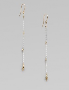 Gracefully dangling strands of sterling silver chain, sprinkled and tipped with glowing faceted beads of 14k gold.14k yellow gold and sterling silverLength, about 2¼Ear wireMade in USA Gracefully dangling strands of sterling silver chain, sprinkled and tipped with glowing faceted beads of 14k gold.14k yellow gold and sterling silverLength, about 2¼Ear wireMade in USA
