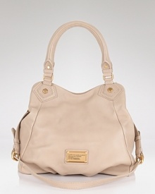 MARC BY MARC JACOBS' leather tote lifts your day bag into luxe territory. The classy carryall loves tweed and knee-high boots, whether you're downtown or in the countryside. MARC BY MARC JACOBS' leather tote lifts your day bag into luxe territory. The classy carryall loves tweed and knee-high boots, whether you're downtown or in the countryside.
