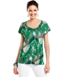 Warm up to summer in this Calvin Klein Jeans top, featuring a lush botanical-inspired print. Sequins at the neckline add an extra splash of flash! Warm up to summer in this Calvin Klein Jeans top, featuring a lush botanical-inspired print. Sequins at the neckline add an extra splash of flash!