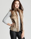 Plush rabbit fur lends undeniable glamour to this MICHAEL Michael Kors Petites vest--a luxe statement for the new season.