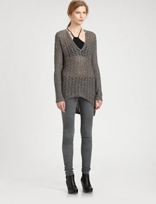 Woven from the finest alpaca and silk, this open-knit sweater is reinvented by dropped shoulders and an asymmetrical hi-lo hem. V-neckDropped shouldersLong sleevesAsymmetrical hi-lo hem75% alpaca/25% silkDry cleanImported of Italian fabricModel shown is 5'10 (177cm) wearing US size Small.